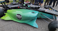 Close up view of green Hexagon branded Indy car